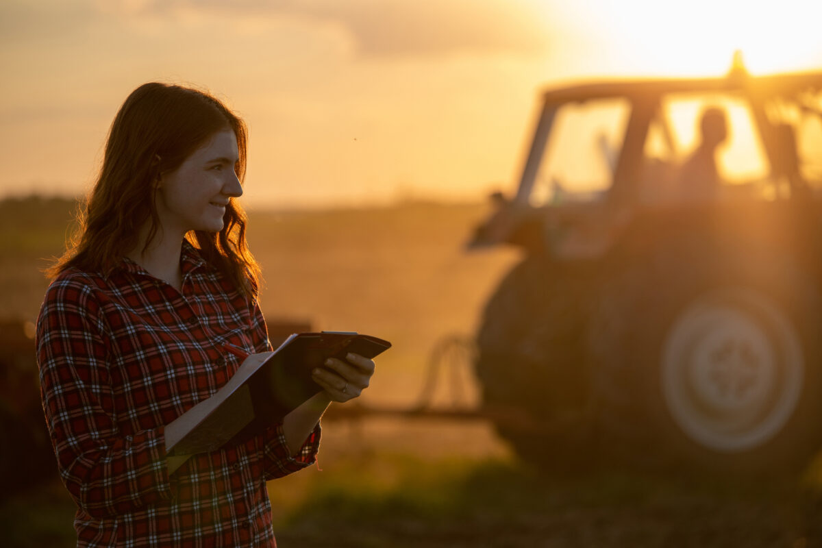 Farmer woman in field repair